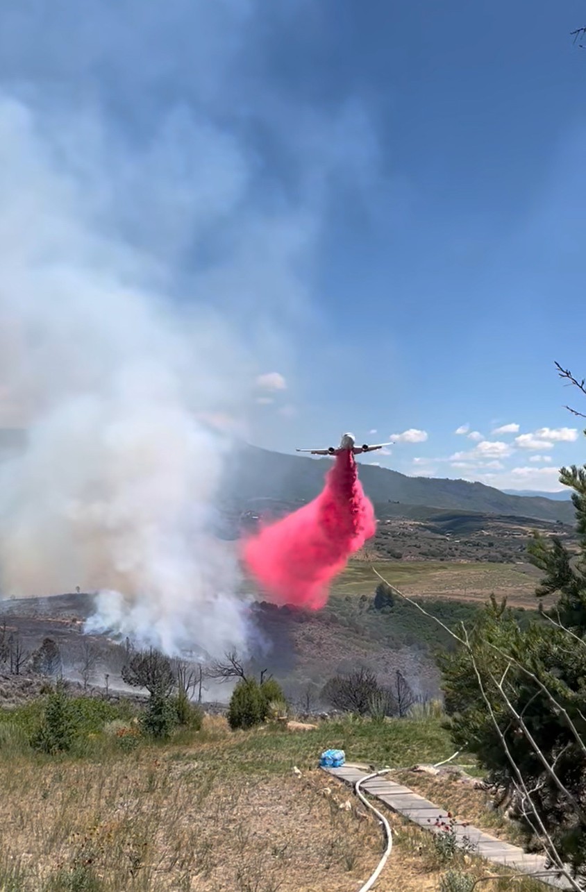 Fire retardant dropping on a wildfire
